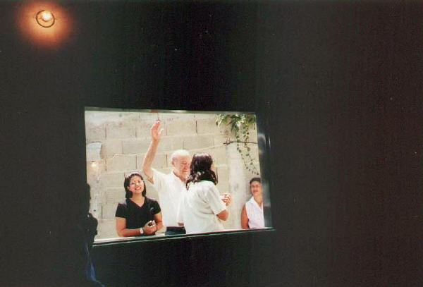 watching baptism through window