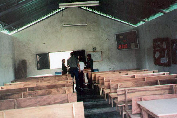 the completed pews and some of the tables 